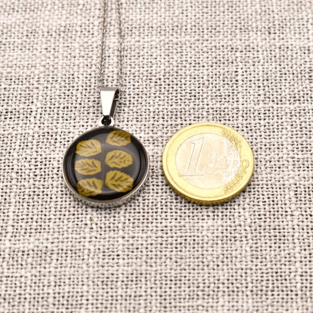 Real fern in round pendant