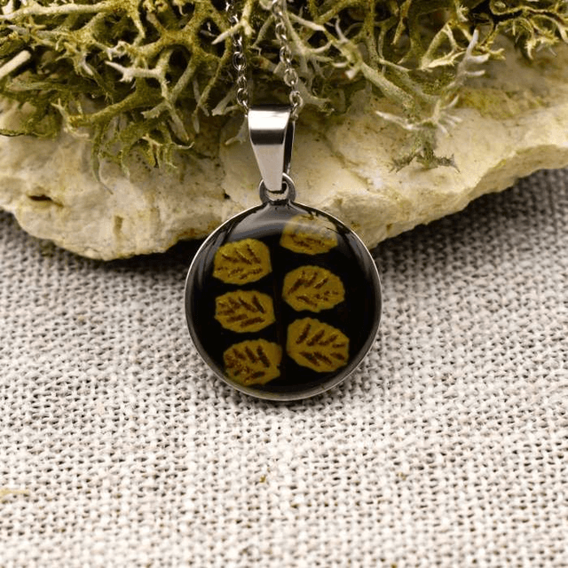 Real fern in round pendant