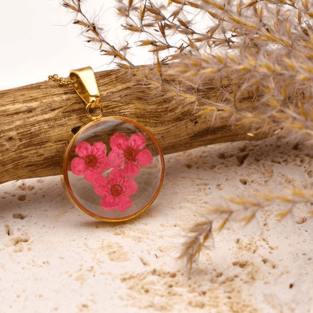 Pink blossom in round pendant