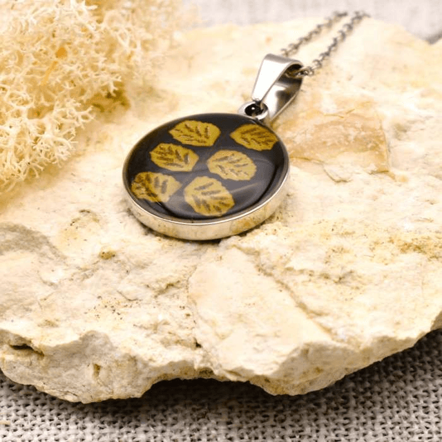 Real fern in round pendant