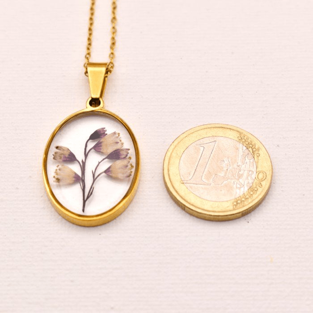 Subtile Heuchera flowers in oval pendant