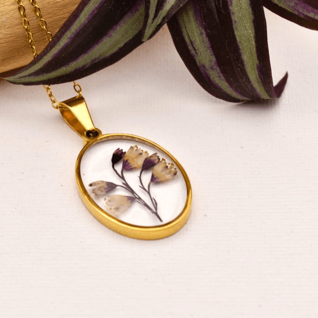 Subtile Heuchera flowers in oval pendant