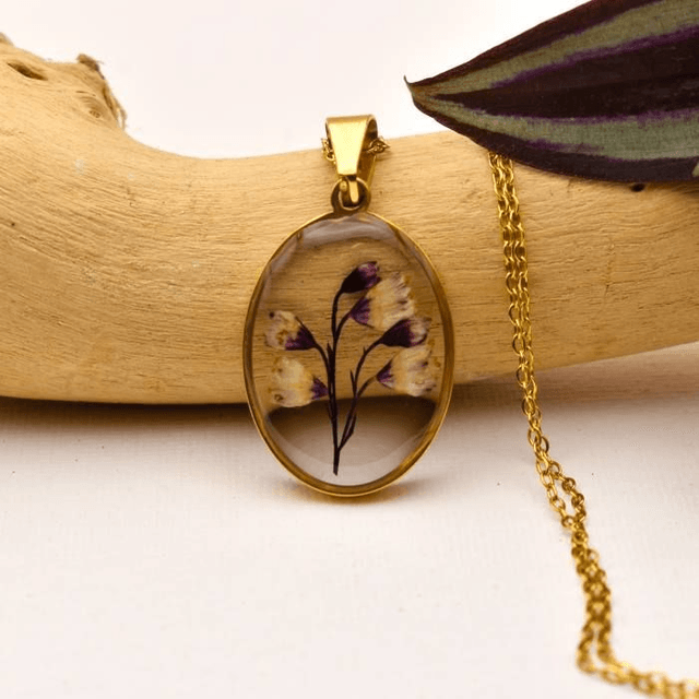 Subtile Heuchera flowers in oval pendant